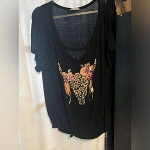 Cute top with western design and cut out detail at neck.